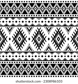 Fondo geométrico impecable con motivos tribales. Patrón étnico. Colores en blanco y negro. Diseño para plantillas textiles, tela, ropa, cortina, alfombra, ornamento, fondo, envoltura.