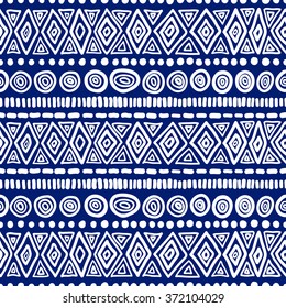 Seamless geometric ethnic pattern. Blue and White structure of the traditional folk forms. Vector painted hands.