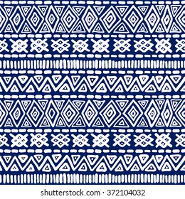 Seamless geometric ethnic pattern. Blue and White structure of the traditional folk forms. Vector painted hands.