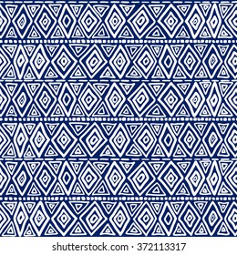 Seamless geometric ethnic pattern. Blue and White structure of the traditional folk forms. Vector painted hands.