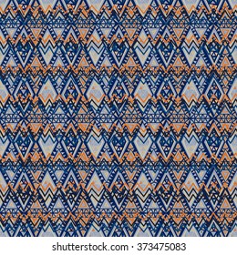 Seamless geometric ethnic pattern. Bright colored structure of the traditional folk forms. Vector painted hands.