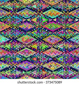 Seamless geometric ethnic pattern. Bright colored structure of the traditional folk forms. Vector painted hands.