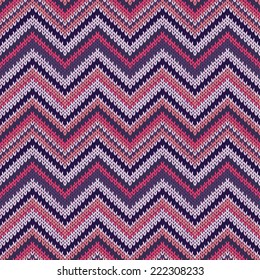 Seamless geometric ethnic spokes knitted pattern. Blue white red pink color knitwear sample