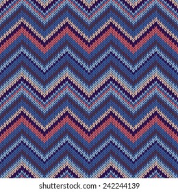 Seamless geometric ethnic spokes knitted pattern. Blue white orange beige color knitwear sample