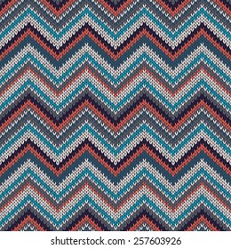 Seamless geometric ethnic spokes knitted pattern. Blue white red grey black color knitwear sample