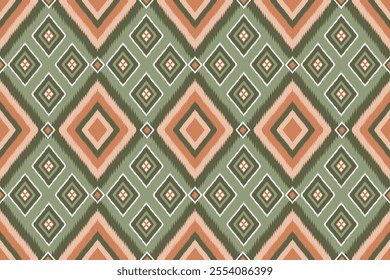 Seamless geometric Ikat orange and white triangle shape ethnic Asian tradition pattern on pastel green  background. Silk and fabric pattern decoration for Thai clothing and wrapping and wallpaper