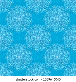 Seamless geometric lace pattern of a circular white mandala on a blue background.