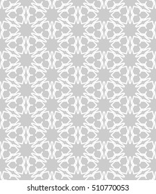 Seamless geometric line pattern in arabian style, ethnic ornament. Endless hexagonal texture for wallpaper, banners, invitation cards. Gray and white graphic lace background