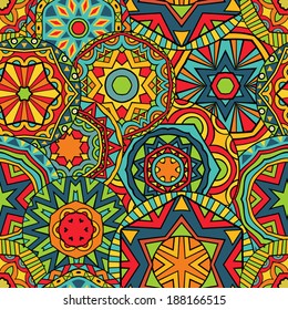 Seamless geometric pattern. Abstract ethnic pattern in vivid colors. Fancy multicolored background ornament. Vector file is grouped EPS8. Drop pattern into your AI swatches and use as fill.