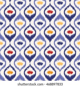 Seamless geometric pattern, based on ikat fabric style. Vector illustration.