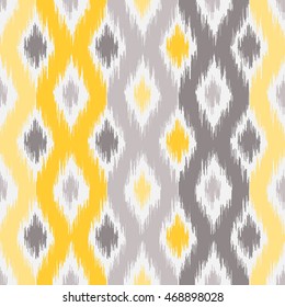 Seamless geometric pattern, based on ikat fabric style. Vector illustration.