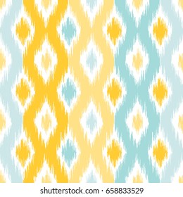 Seamless geometric pattern, based on ikat fabric style. Vector illustration. Carpet rug texture vector imitation. Yellow and turquoise mint ogee pattern.