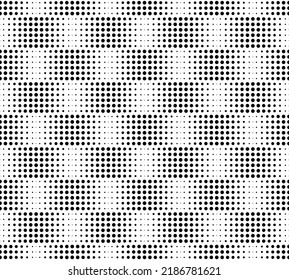 Seamless geometric pattern of black circles on a white background. Staggered attenuation