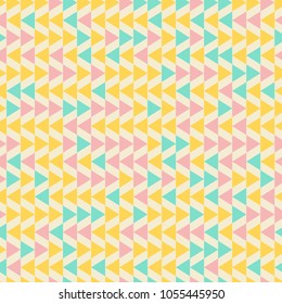 Seamless geometric pattern with blue, pink and yellow triangles on white background.