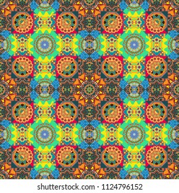Seamless geometric pattern of blue, yellow green and oreange tiles.