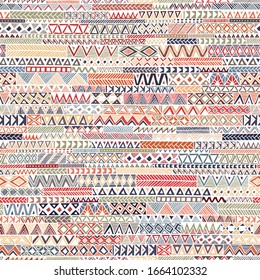 Seamless geometric pattern in bohemian style. Hand-drawn patchwork ornament. Colorful print for textiles. Ethnic and tribal motifs. Vector illustration.