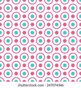 Seamless geometric pattern with bright pink and blue dots and circles. Seamless pattern can be used for wallpaper, pattern fills, web page background, surface textures.