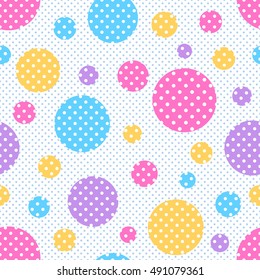 Seamless geometric pattern with colored circles with white polka dots on a background of polka dots. Vector illustration.