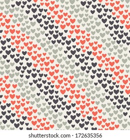 Seamless geometric pattern. Diagonal stripes of hearts. Vector repeating texture