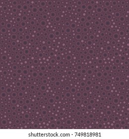 Seamless geometric pattern. Elements of round shape, located on a dark thistle background. For your design.