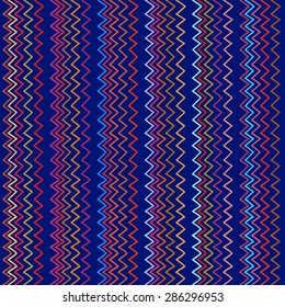 Seamless geometric pattern in ethnic style, brightly colored stripes and zigzag on a dark blue background.