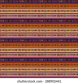 Seamless geometric pattern in ethnic style, a bright structure of rhombus, triangle and zigzags.
