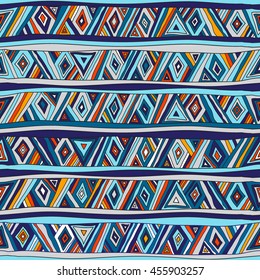 Seamless geometric pattern in ethnic style. Tribal, folk traditional motifs. Triangles, zigzags, stripes. Painted hands. Cheerful motley color.