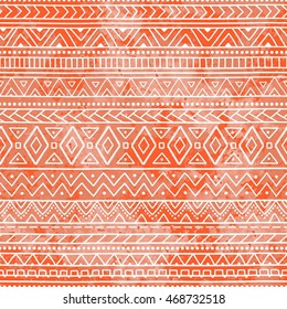 Seamless geometric pattern. Ethnic and tribal motifs. Bright orange ornament. Watercolor texture. Vector illustration.