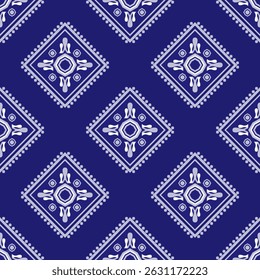 A seamless geometric pattern featuring stylized diamond shapes and intricate ethnic-inspired motifs in white over a rich indigo blue background. The design is arranged in horizontal stripes.