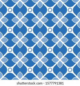 Seamless geometric pattern with flowers. Vector art.