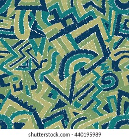 Seamless geometric pattern. Green and blue shades. Embroider motifs. Handmade. Vector illustration.