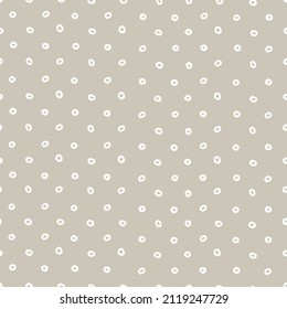 Seamless geometric pattern with hand drawn uneven white rings on beige background for surface design, craft, apparel and other design projects