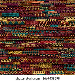 Seamless geometric pattern in patchwork style. Ethnic and tribal motifs. Grunge texture. Bohemian ornament for textiles. Vector illustration.