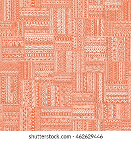 Seamless geometric pattern in patchwork style. Square patches of mosaic. Ornament painted by hand. Ethnic and tribal elements. White, orange and coral colors. Vector illustration.