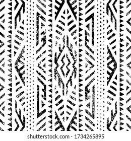 Seamless geometric pattern. Print for your textile. Ethnic and tribal motifs. Black and white ornament. Grungy texture. Vector illustrations.