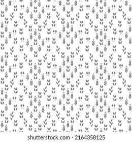 seamless geometric pattern with silhouettes of flowers and leaves