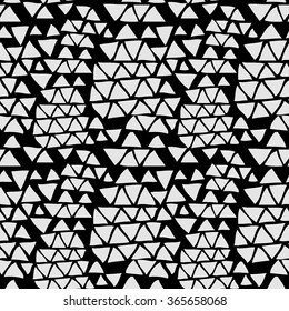Seamless geometric pattern with triangles . Abstract background. Vector illustration. Hand drawn motive. Monochrome.