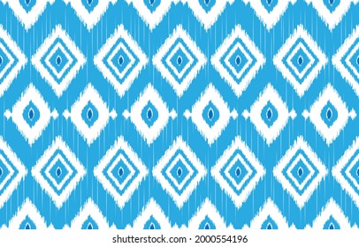 seamless geometric pattern. Tribal Art Ikat Ogee in traditional classic blue and white colors. based on ikat fabric style. Vector illustration.