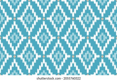 seamless geometric pattern. Tribal Art Ikat Ogee in traditional classic blue colors. based on ikat fabric style. Vector illustration.