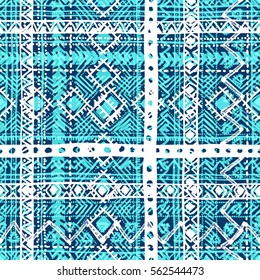 Seamless geometric pattern. Tribal and ethnic motifs. The blue and white elements. Grungy texture. Vector illustration.