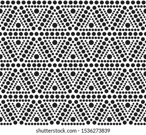 Seamless geometric pattern. Vector illustration. Repeating ethnic ornamental design. Triangles shape  elements of dots. Modern black and white print.