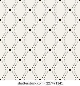 Seamless geometric pattern. Vertical wavy dotted stripes. Vector repeating texture with circles