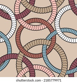 Seamless geometric pattern with white, pink and blue circles and rings on a brown background. Rope shaped lines. Vector illustration for textile, wrapping, packaging, print, and decorative projects.