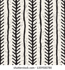 Seamless geometric vector pattern. Monochrome black and white brush strokes background. Hand drawn ink vertical lines texture.