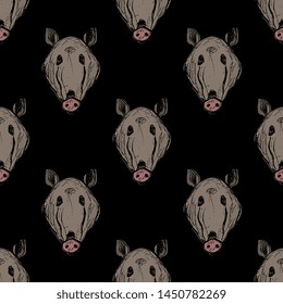 Seamless geometrical animal pattern with hand drawn heads of wild boar or wild pig.
