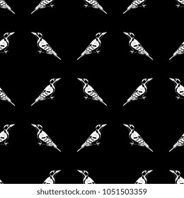 Seamless geometrical black and white pattern with silhouettes of woodpeckers. Based on hand drawn sketch.