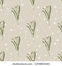 Seamless geometrical floral pattern with snowdrop flowers (Galanthus nivalis) and snowflakes. Vintage style.