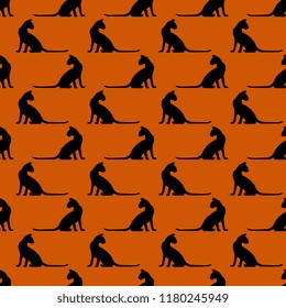 Seamless geometrical Halloween pattern with silhouettes of black cats.
