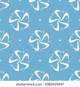 Seamless geometrical pattern with abstract round mandalas and polka dots. White silhouette on blue background.