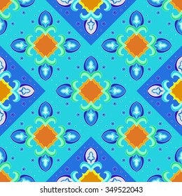 Seamless geometrical pattern in blue, green and orange colors. Vector illustration.